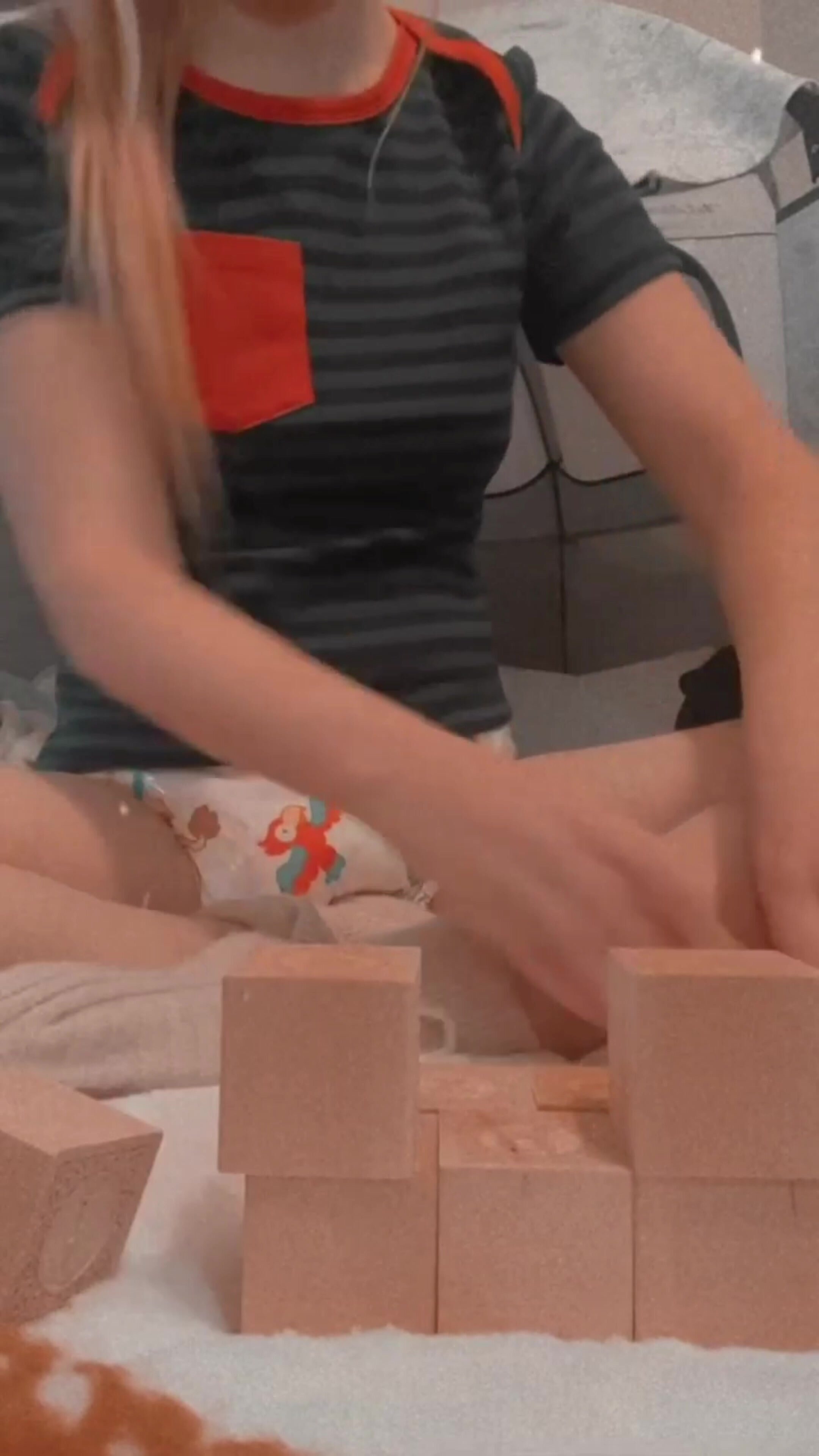 Girl Diapered While Playing With Blocks
