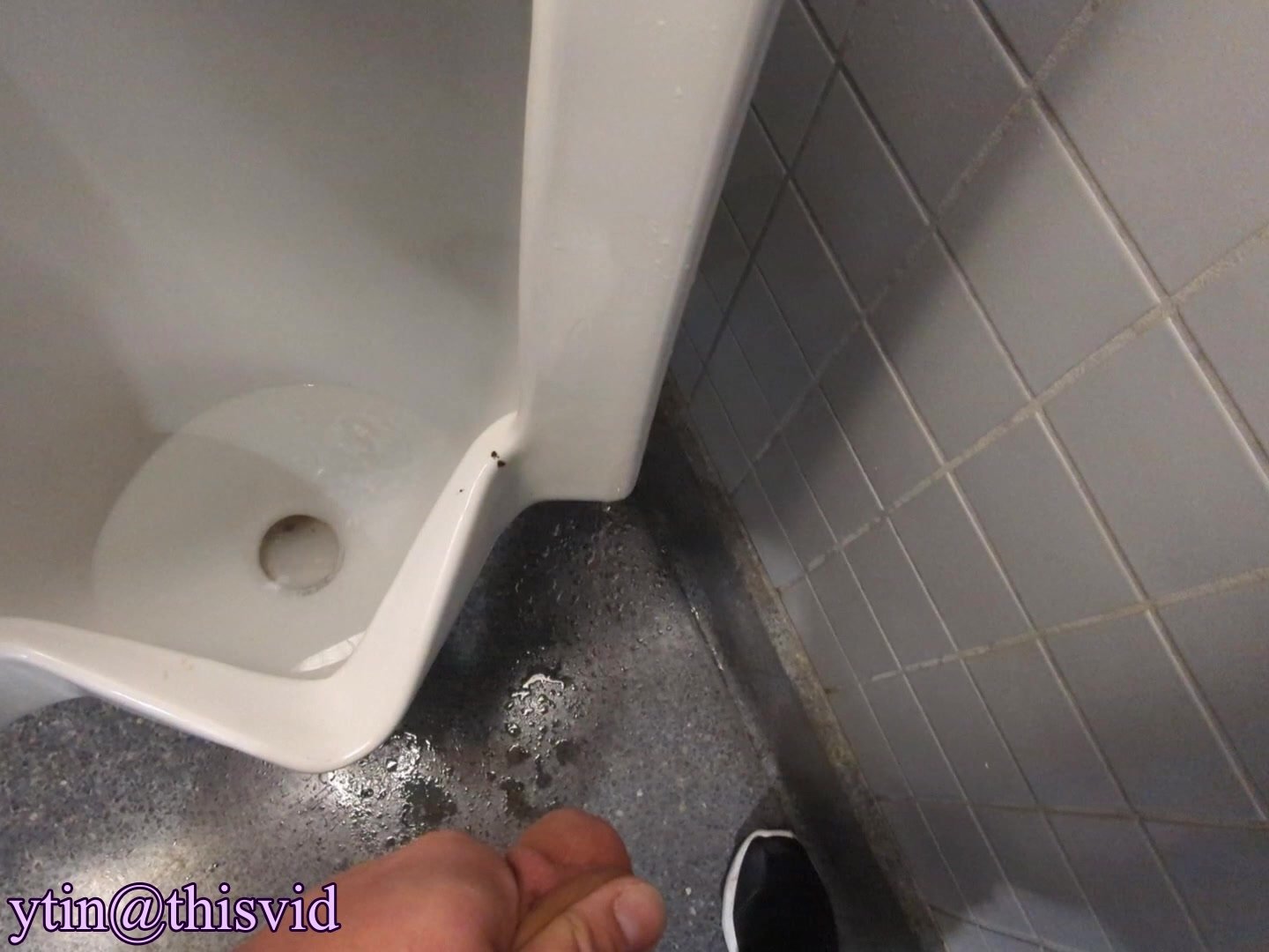 Piss on Floor Next to Urinal with People Present