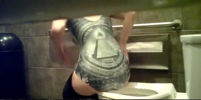 Girl goes to the bathroom wearing an illuminati swimsui