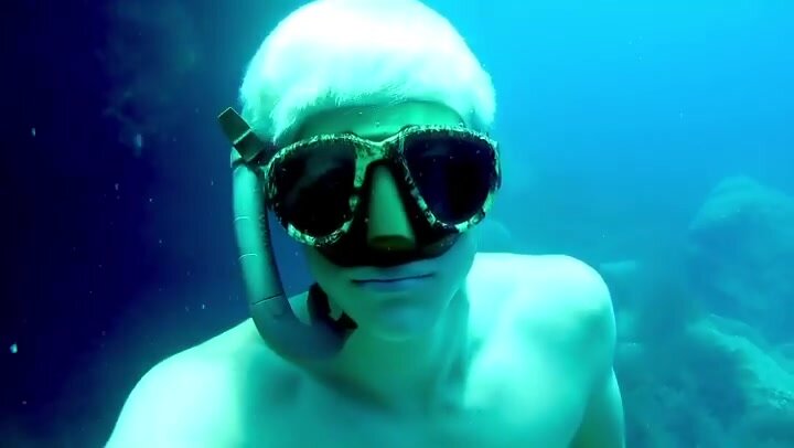 Bleached freediver breatholding underwater