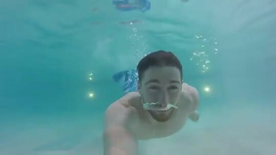 Barefaced merman swimming underwater