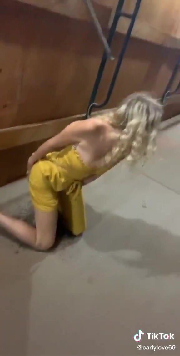 Cute blonde teen get on knees to piss on sidewalk