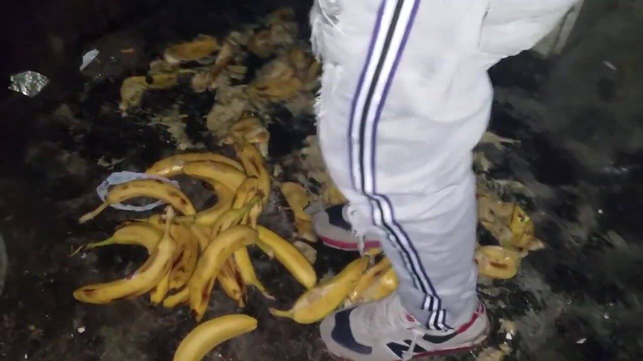 Man Stomping 50 Bananas with Sneakers in Park