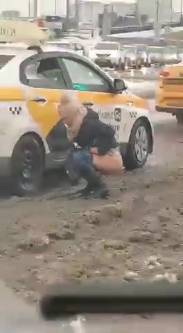 Russian woman pissing beside taxi (yt vid)