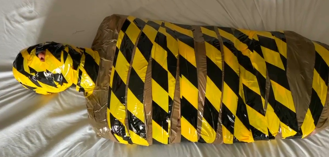 Mummified In Parcel And Hazard Tape