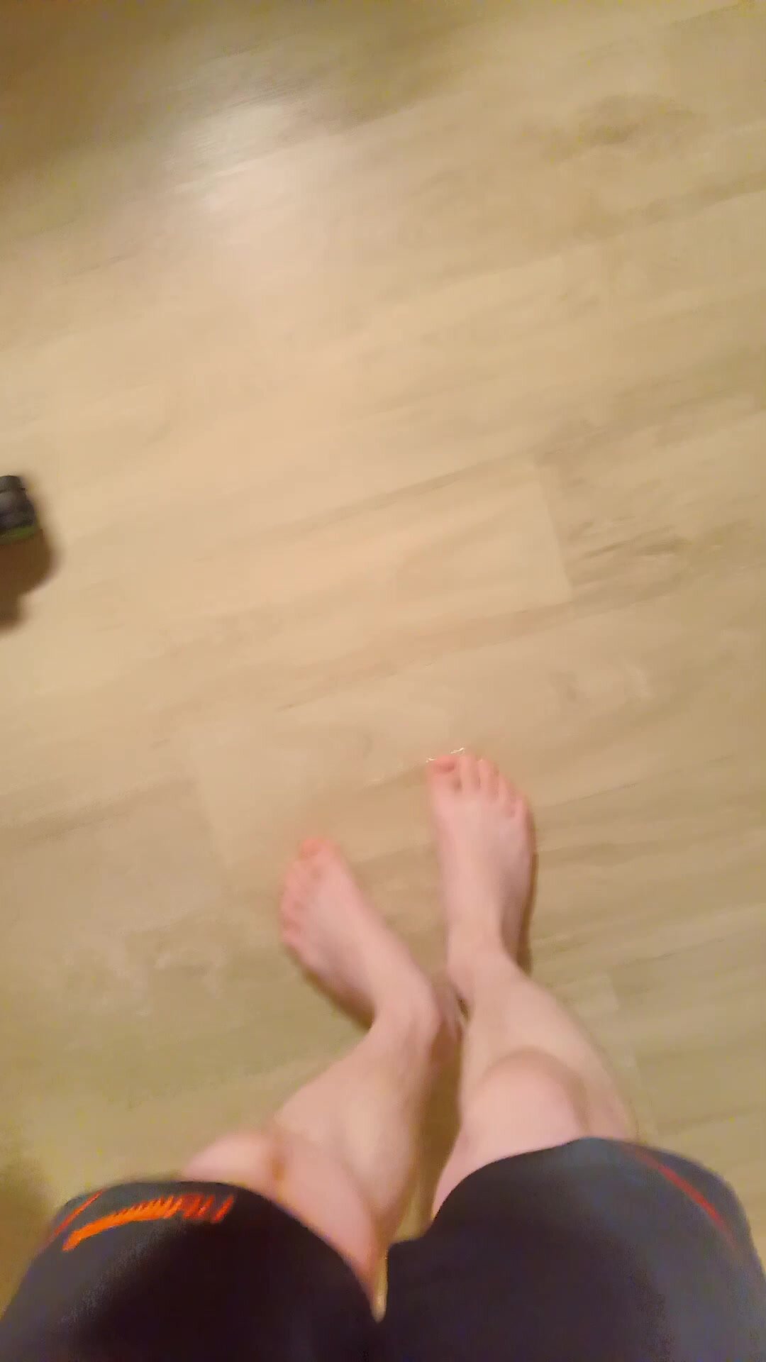 Twink's bare feet in piss puddle