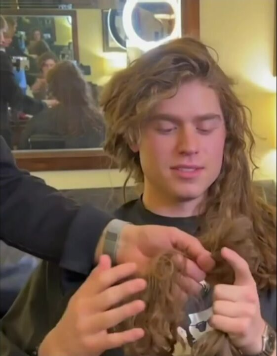Long haired guy cuts his hair (only hair cut) - video 1