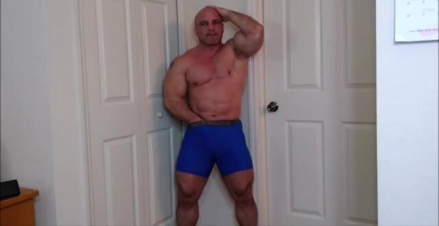 Muscle man jerks in his tight boxers