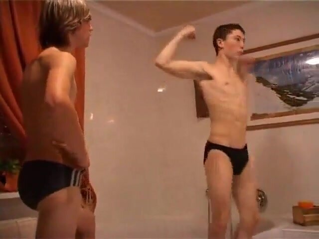 Two twinks flexing in the bathroom
