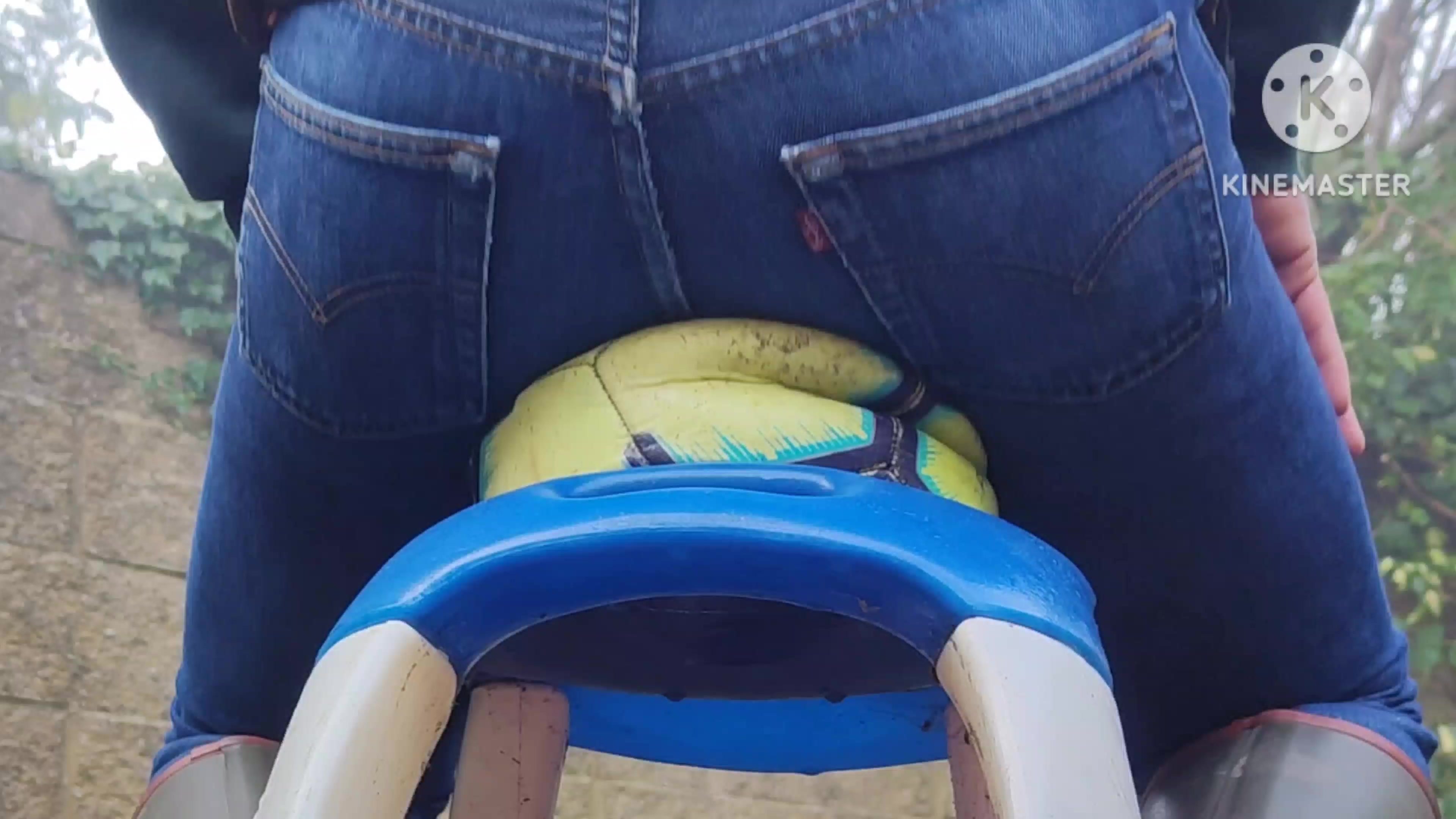 Crushing leather ball with tight Levi's ass