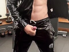 Muscle boy in tracksuit cuming