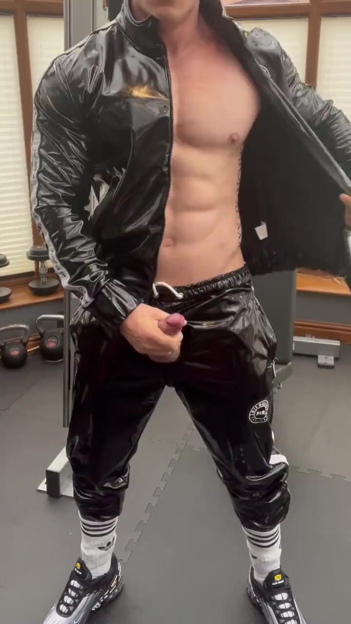 Muscle boy in tracksuit cuming