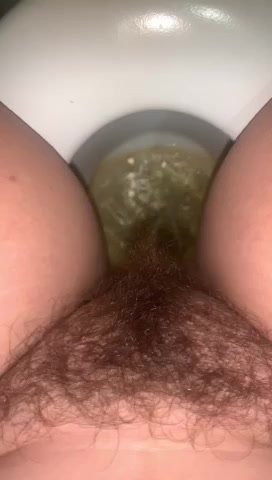 College girl with a hairy pussy peeing