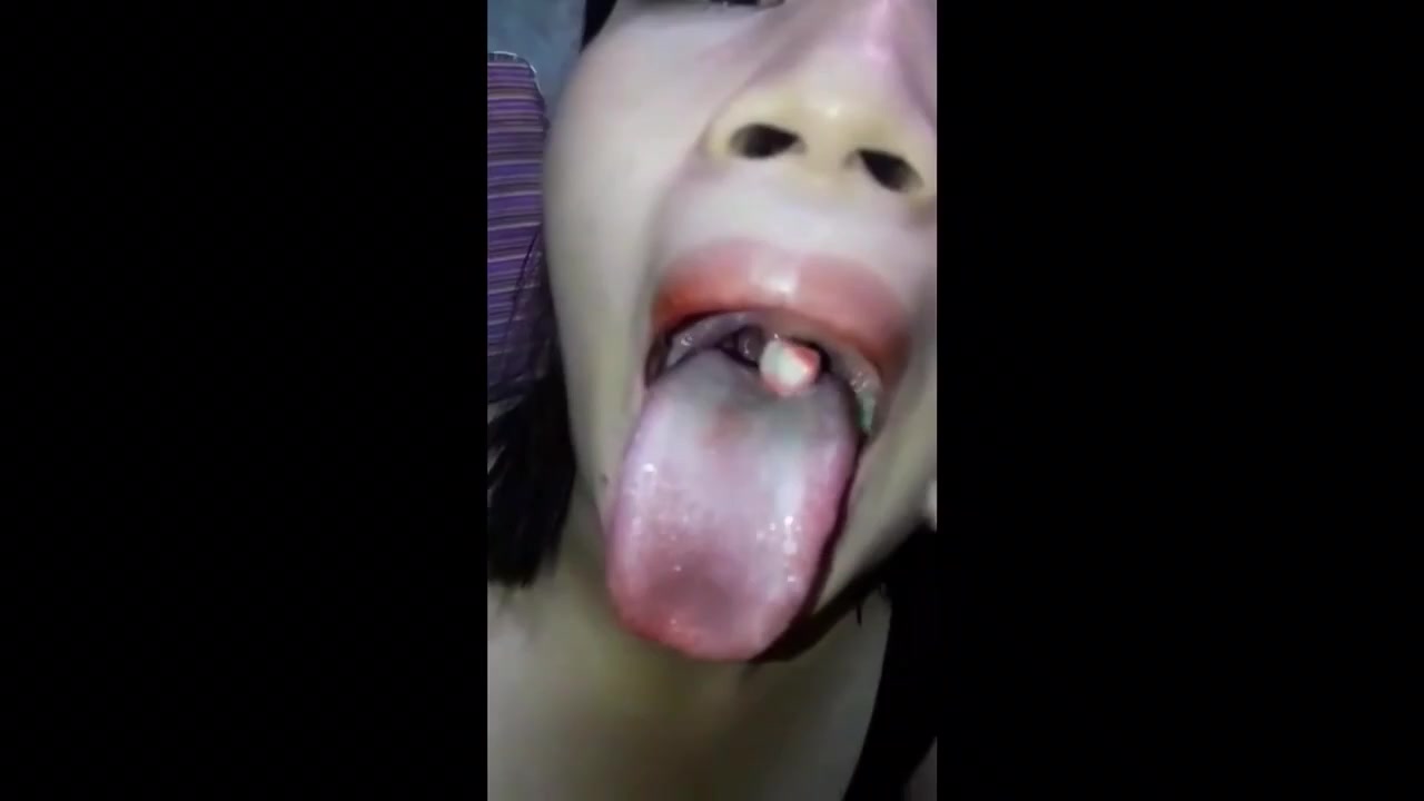 Sexy Girl Swallow Gummy With Open Mouth - video 2