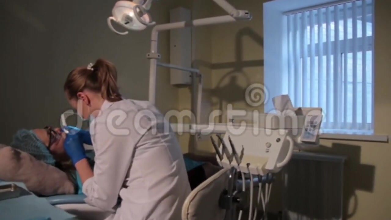 Professional teeth cleaning female patient