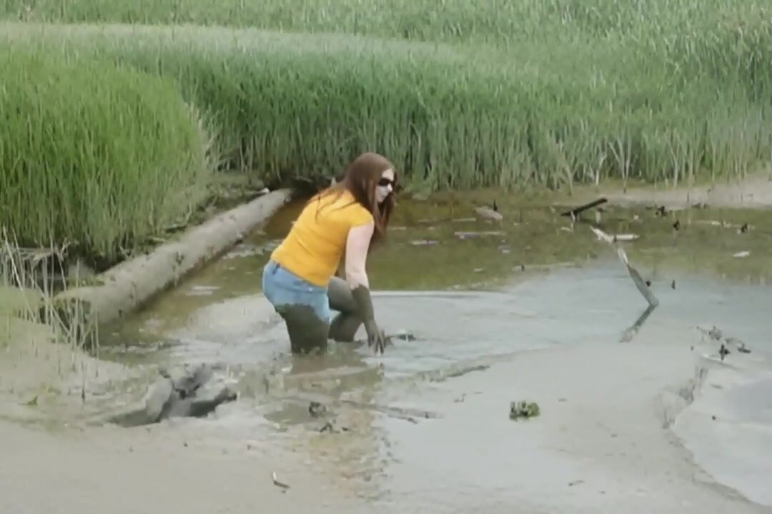 girl playing in the mud - video 3