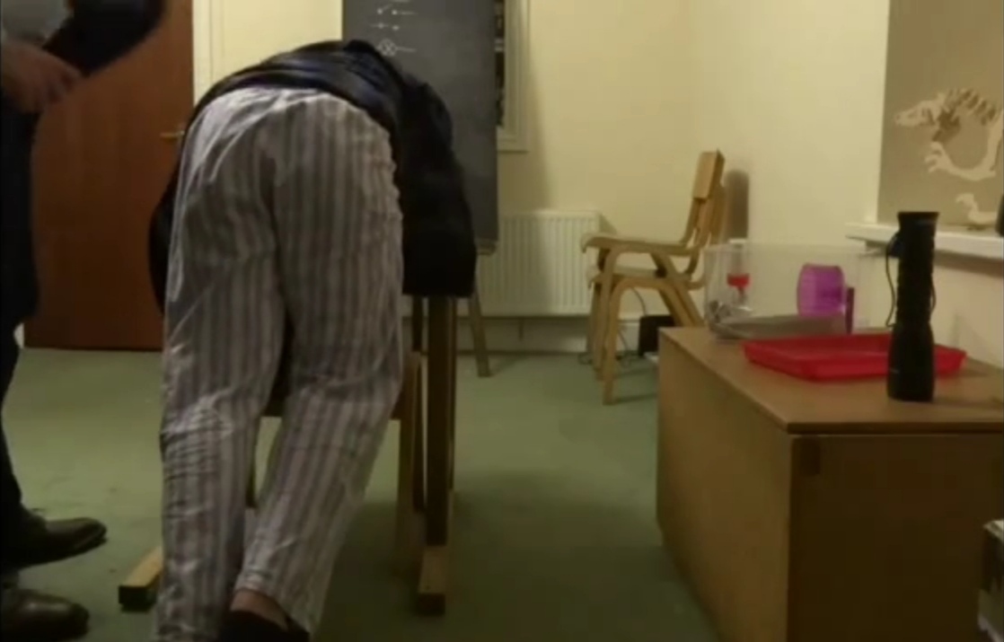 Being spanked by the teacher with slippers