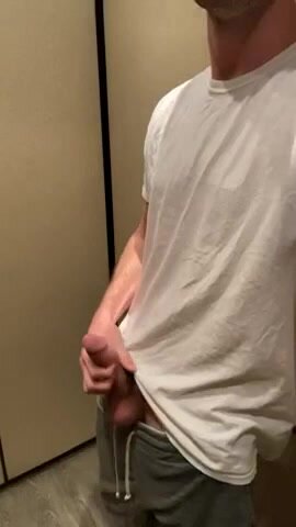 Guy strokes cock in elevator.