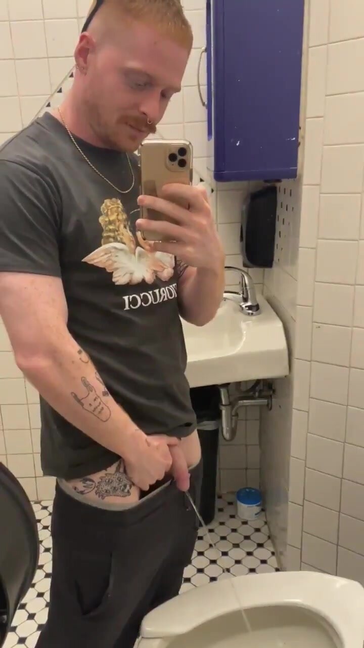 ginger man taking a piss