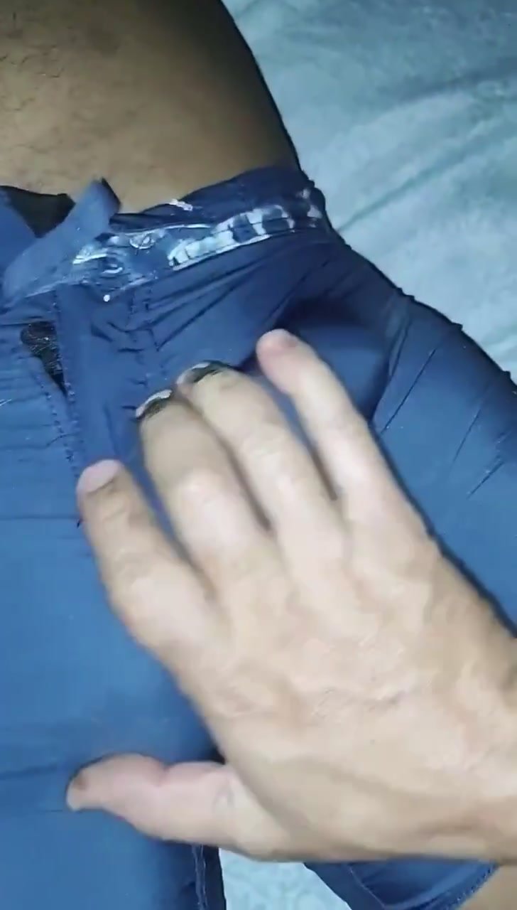 Fondling his bulge until he cums in his shorts