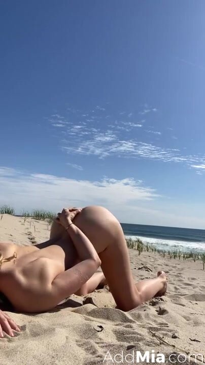 Mia masturbating at the beach