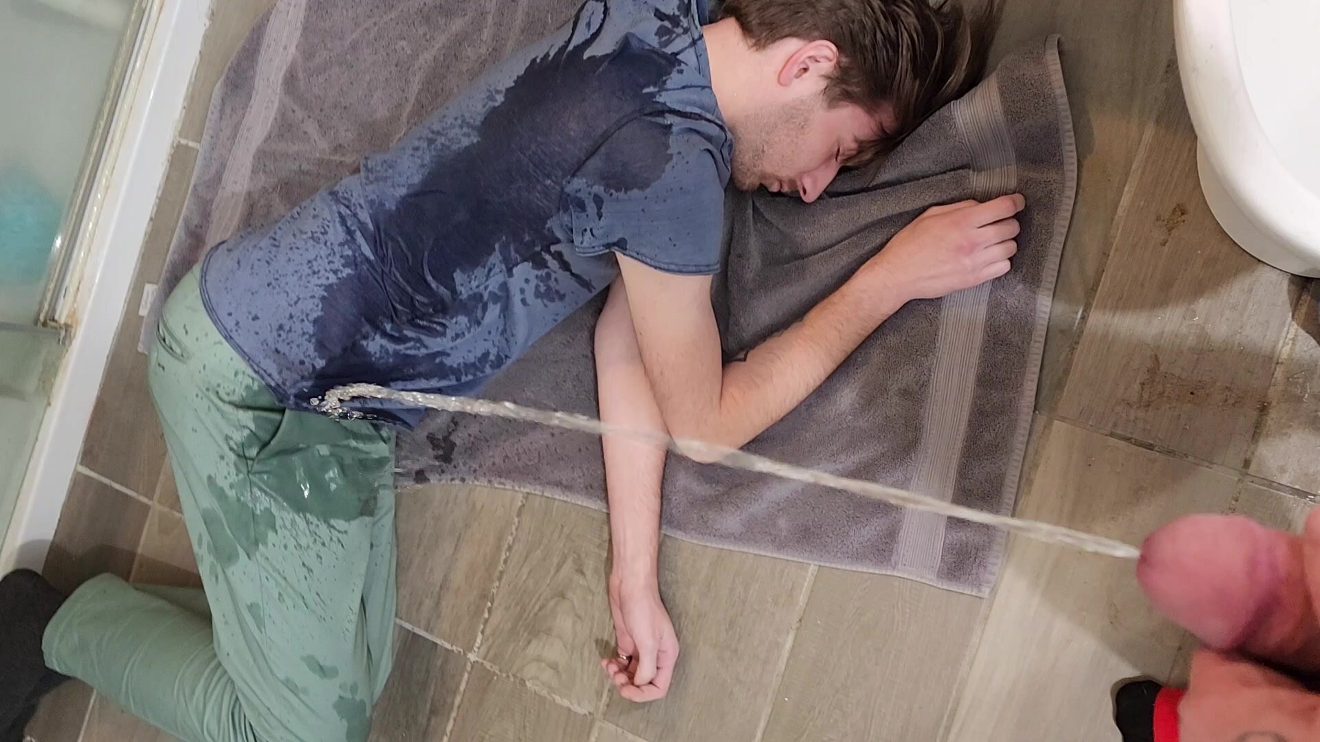 Drunk guy pisses on passed out twink