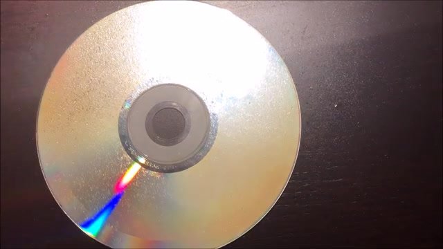 girl sneeze spray on a cd