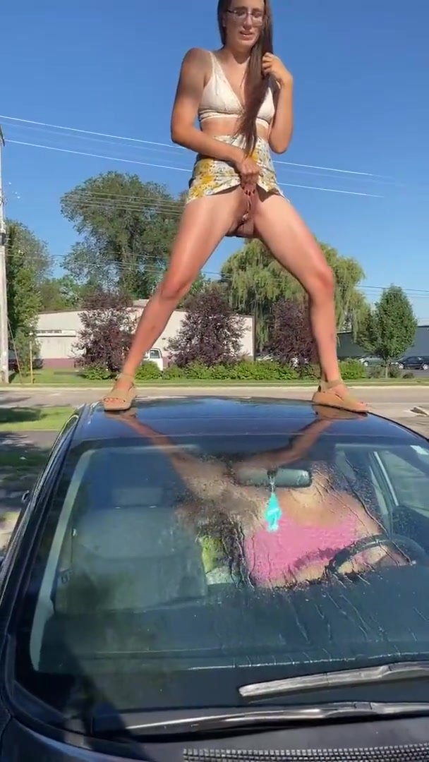 Girl pisses standing on friends car