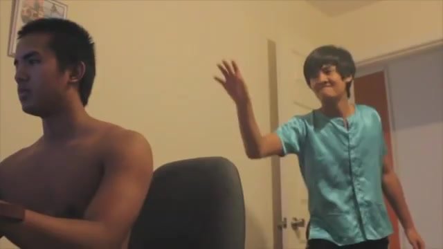 asian looking guy smacks other guy