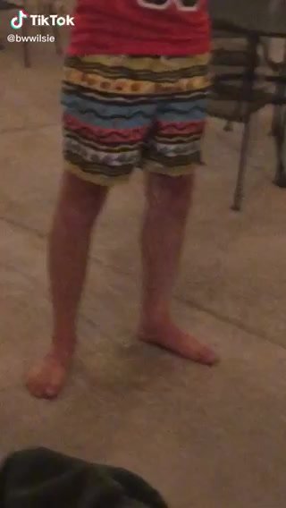 College guy pissing swim trunks