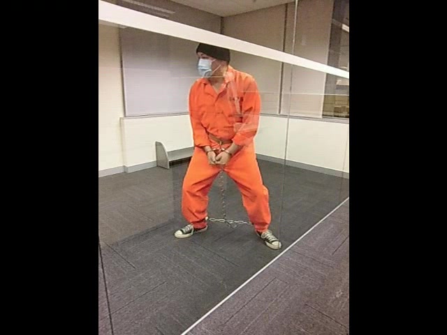 Prisoner kept in strengthen glass holding cell