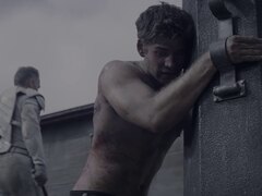 Sexy young man whipped in Hunger Games