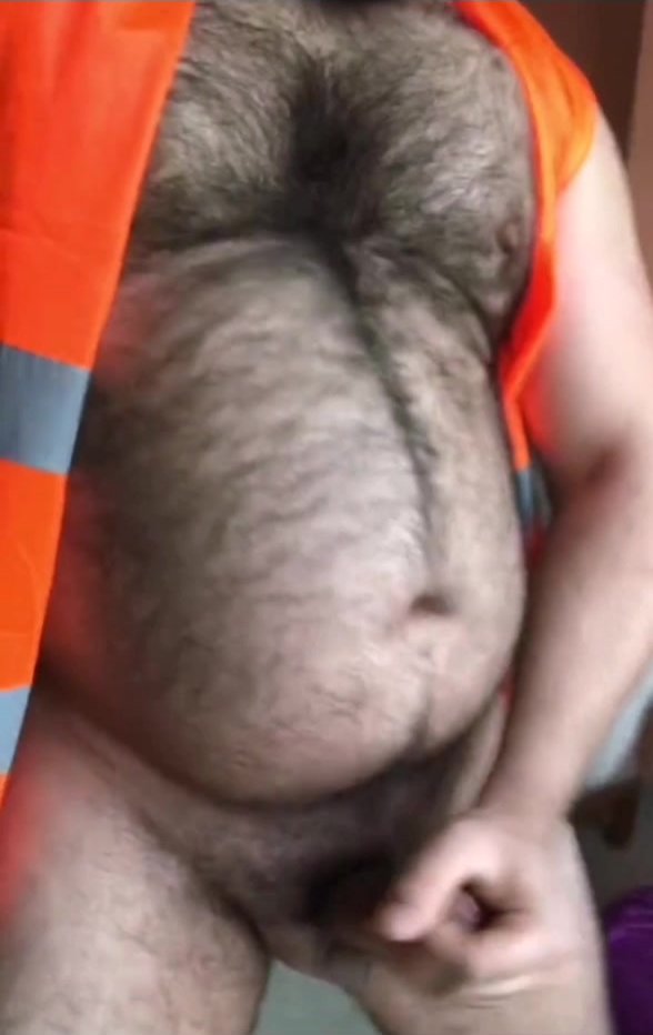 Bear touches his dick while massaging his belly