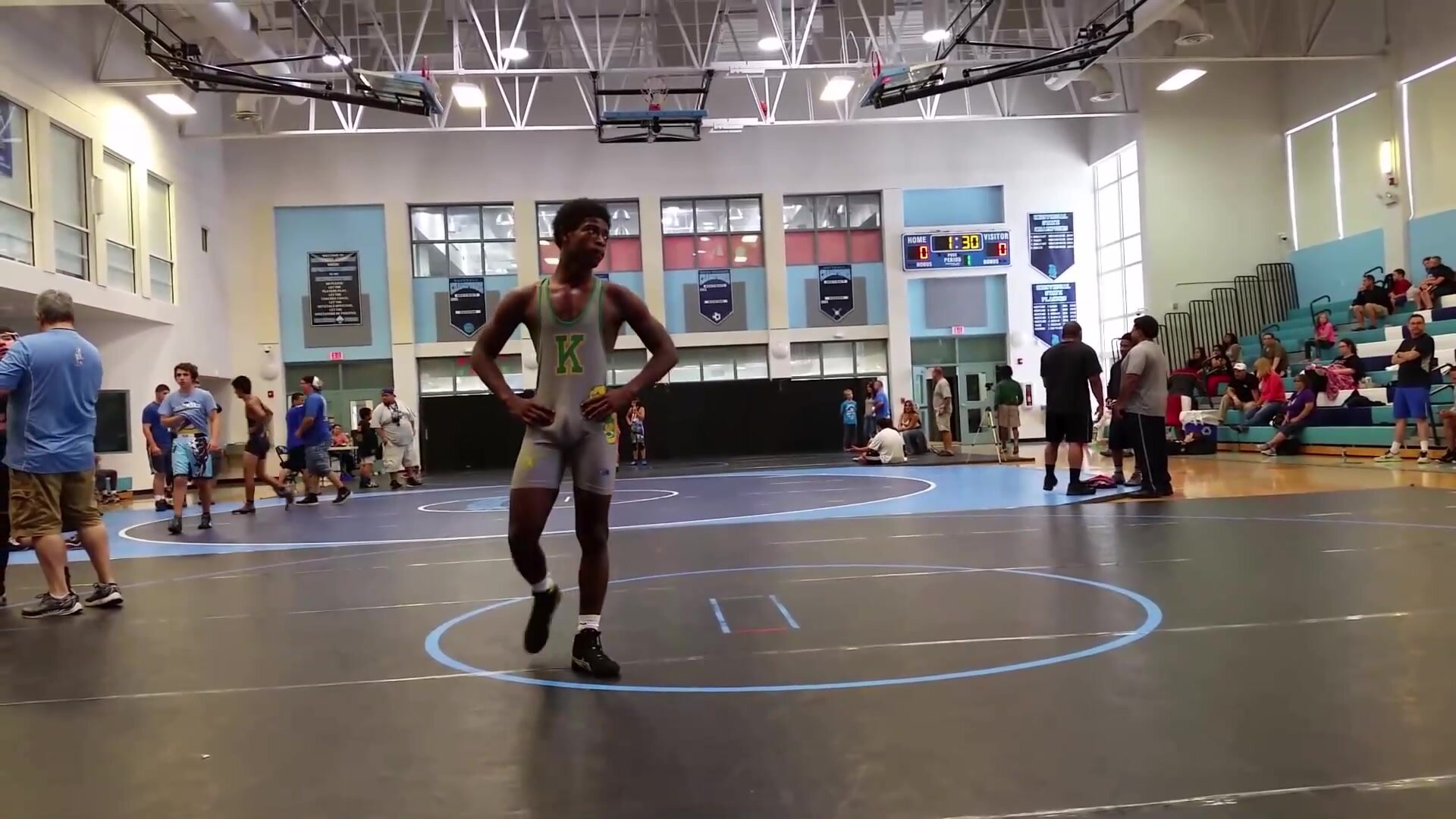 bulging in wrestling suit, small boner or pointing up?
