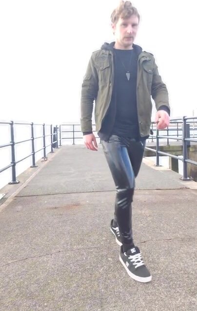 outdoors in rubber pants