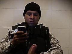 Latino man in police uniform caught beating his meat  in the restroom