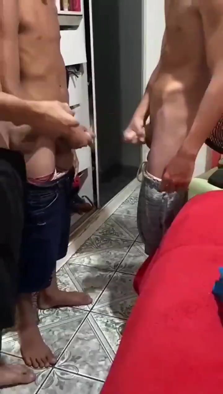 Three friends playing with their cocks together