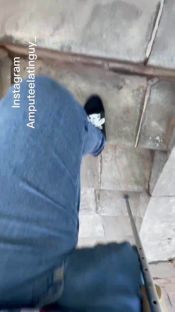 Amputee guy climbing stairs
