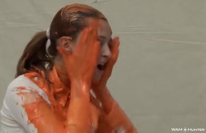 Girl encouraged to cover herself in gunge