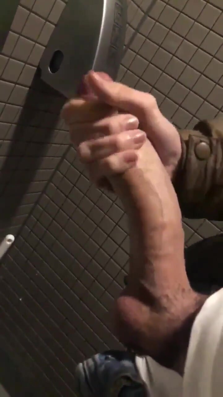 Wanking his huge cock in the toilets (with cum)