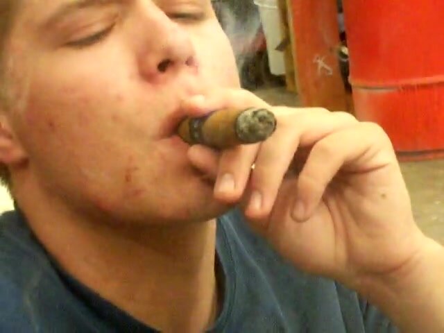 Young cigar close-up smoke