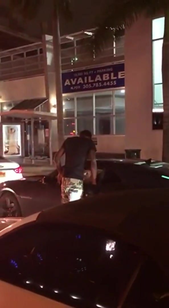 Guy gets head in Miami traffic