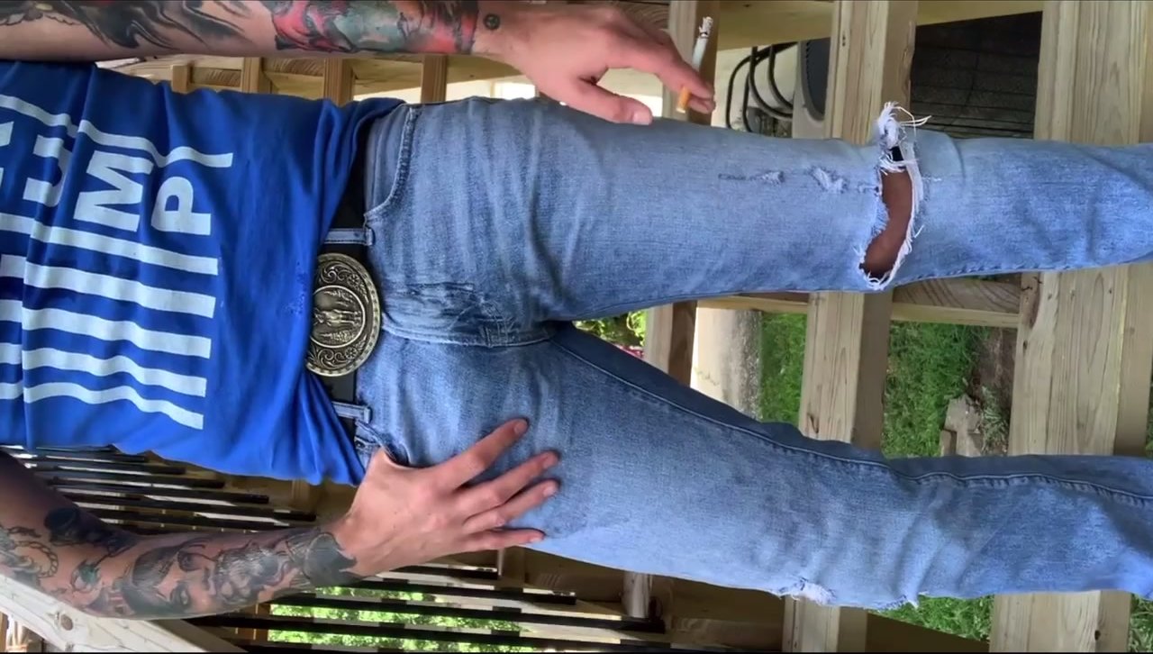 Sexy man pisses his jeans