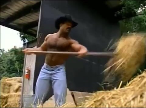 Carl Hardwick doing farm work shirtless