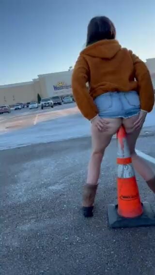 Slim chick fucks traffic cone in mall parking lot