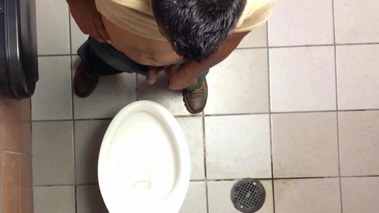 vintage men pissing at urinal