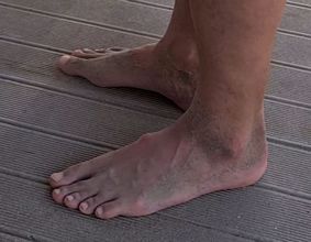 Sandy feet near the beach