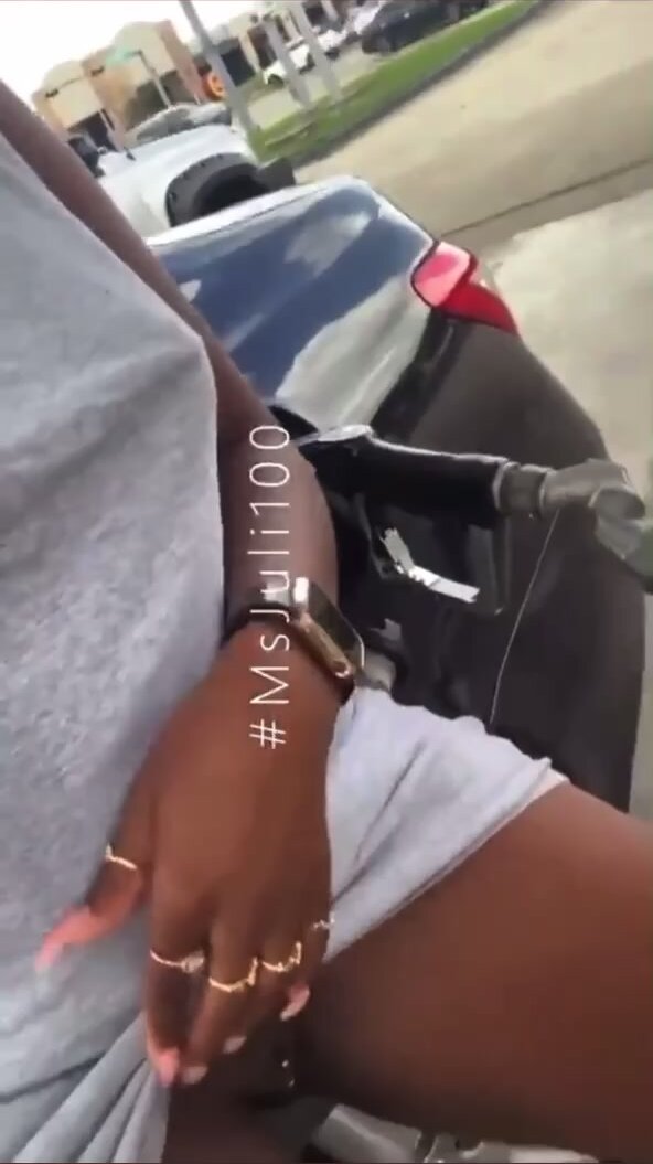 Ebony pisses at gas pump