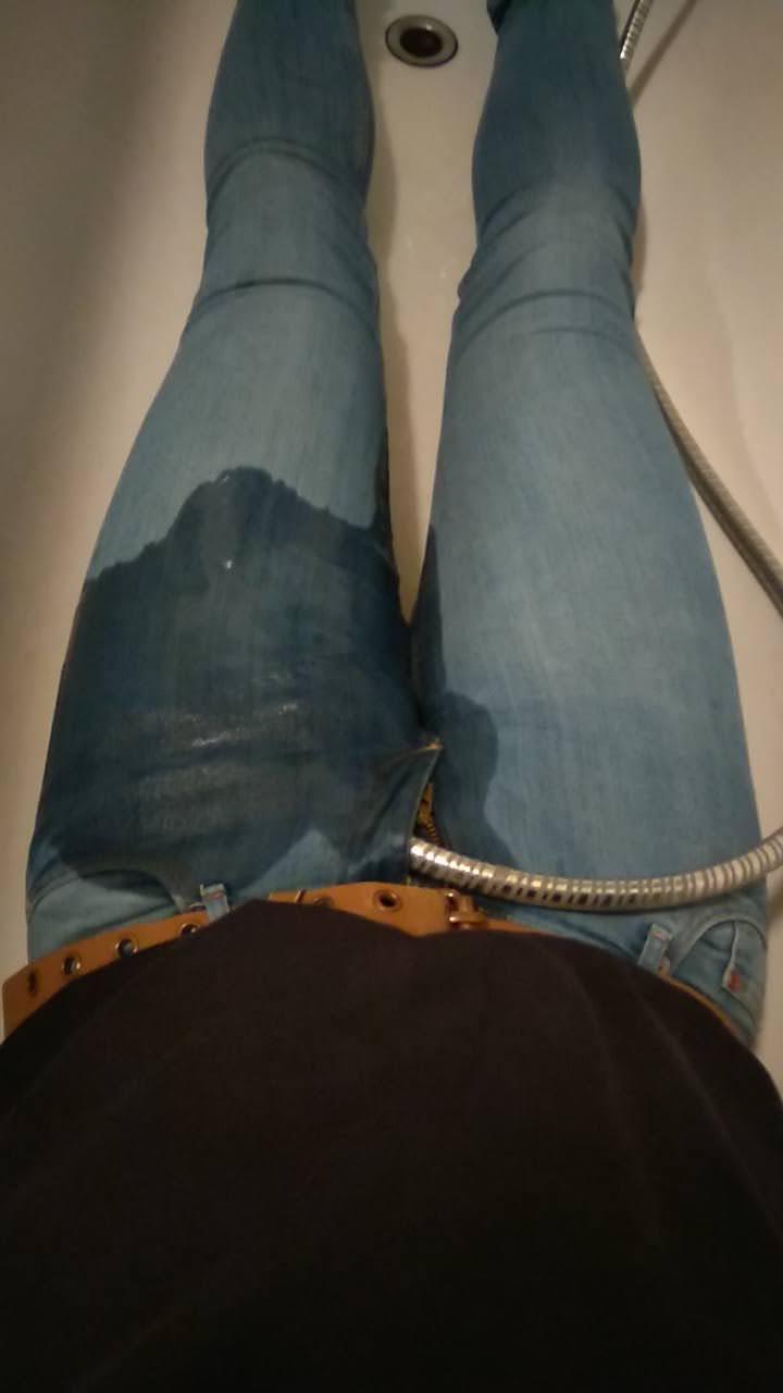 Filling the bathtub with water through my jeans
