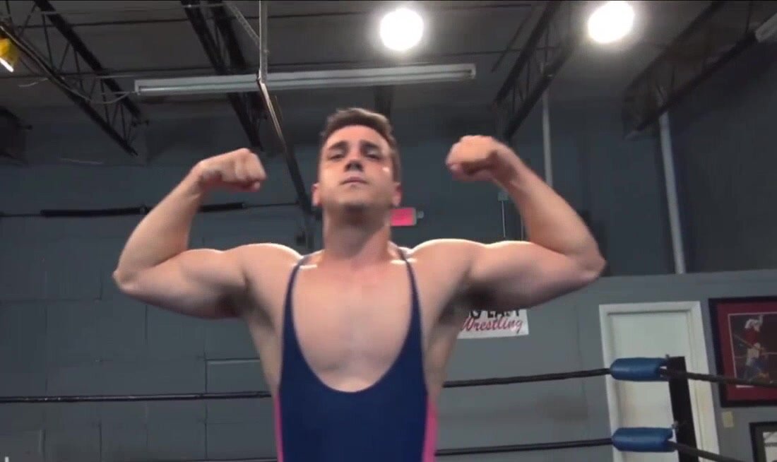 Wrestler  flexing  in singlets